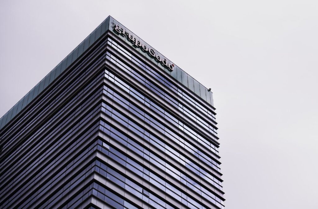High-rise modern office building in Barcelona with sleek architecture and reflective glass facade.